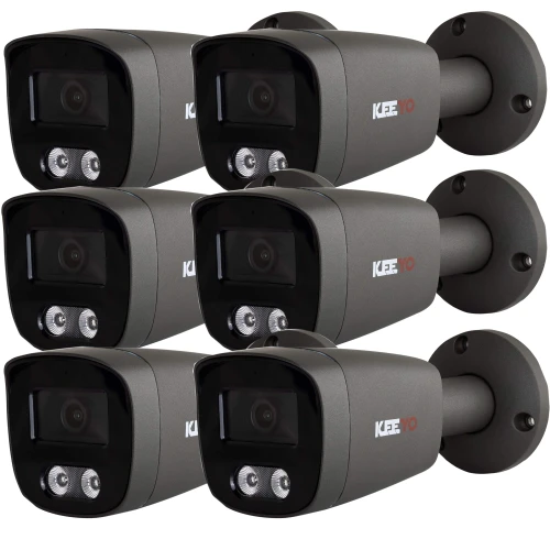 Zdjęcie przedstawia zestaw sześciu tubowych kamer monitoringu w kolorze szarym, ułożonych w dwóch rzędach po trzy. Kamery mają czarne fronty z widocznymi obiektywami i diodami LED.