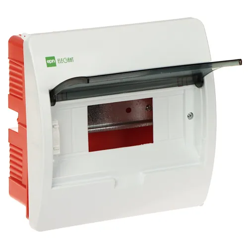 Na zdjęciu znajduje się biały rozdzielacz elektryczny z przezroczystą, uchylną pokrywą, z czerwonymi elementami po bokach. Wewnątrz widoczna jest metalowa płyta montażowa.