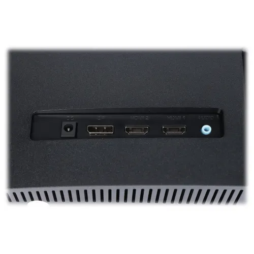 Zdjęcie przedstawia panel złącz monitora z widocznymi portami: DC, DP, HDMI 2, HDMI 1 oraz Audio. Panel jest umieszczony na ciemnej obudowie z otworami wentylacyjnymi poniżej.